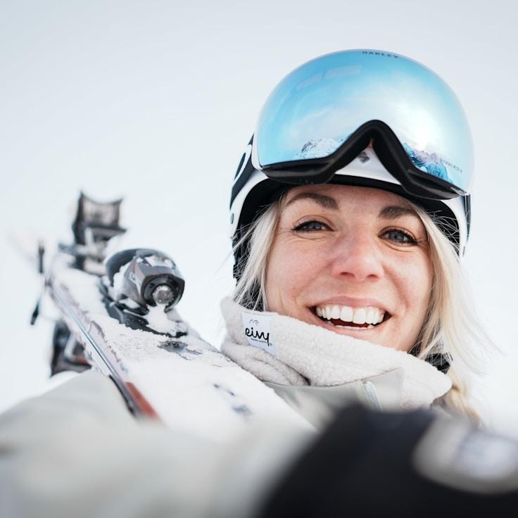 Kaveri Mehta, Lead Design Curator at Calm Meadow Collect, reviewing corporate floral arrangements